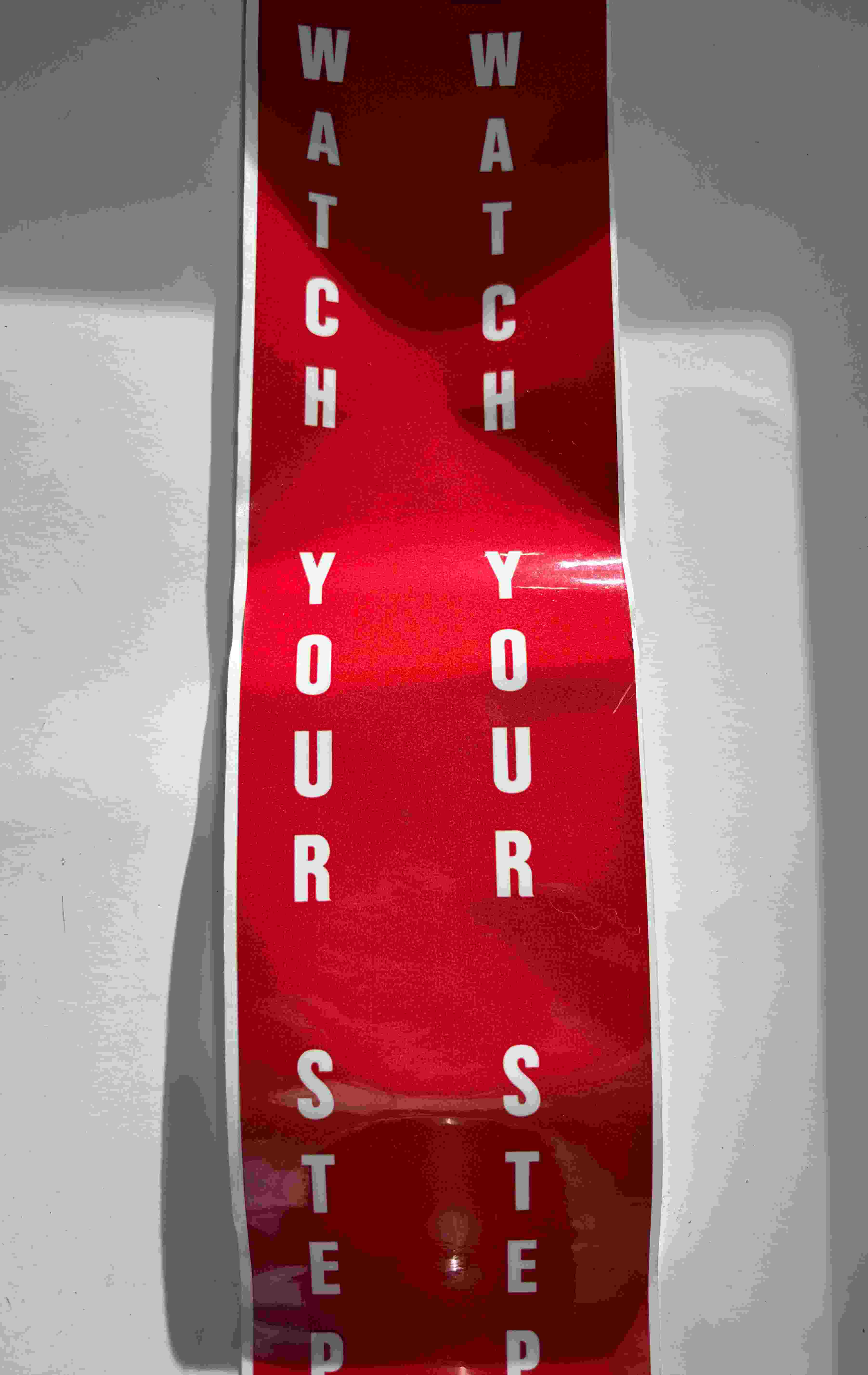 DECAL WATCH YOUR STEP VERTICAL